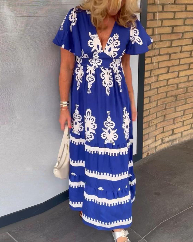 Elegant lang kjole med v-hals med vintage trykk
