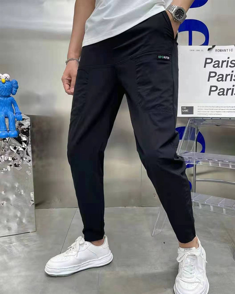 Høystrekkbare skinny cargobukser med flere lommer for menn