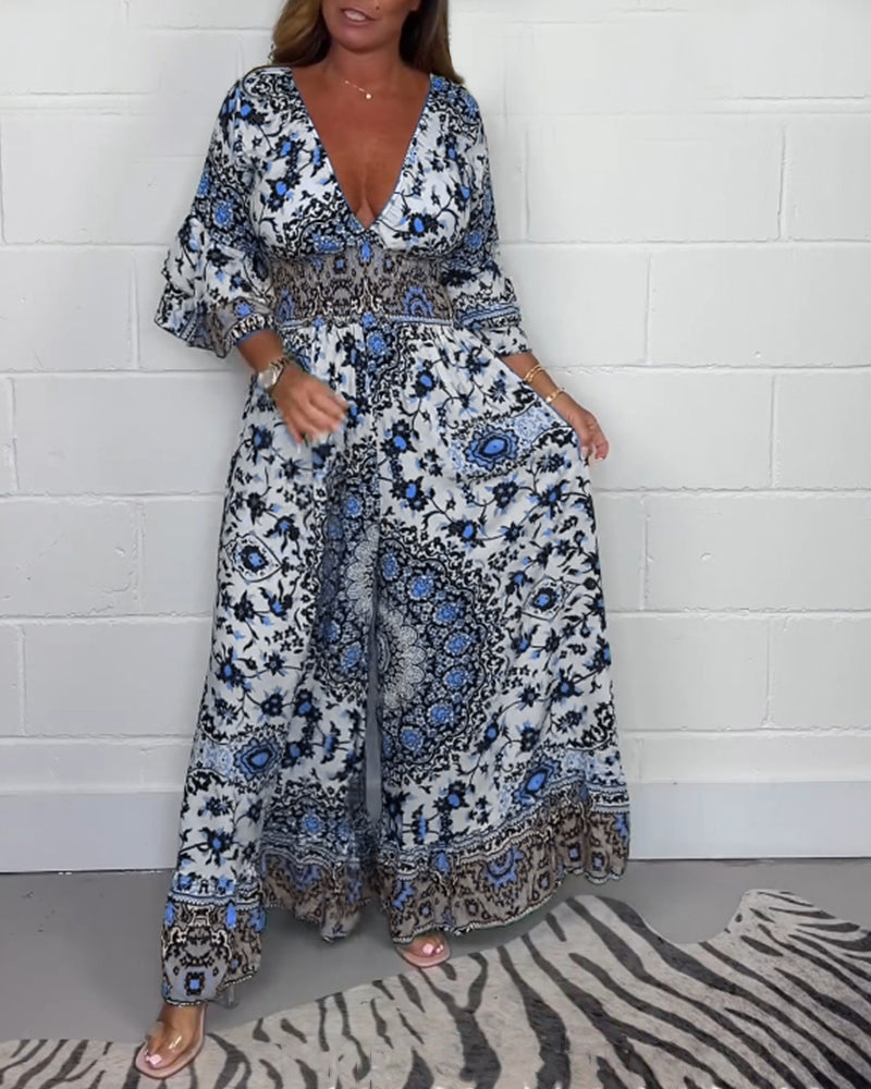 Jumpsuit med trykk og dyp V-hals