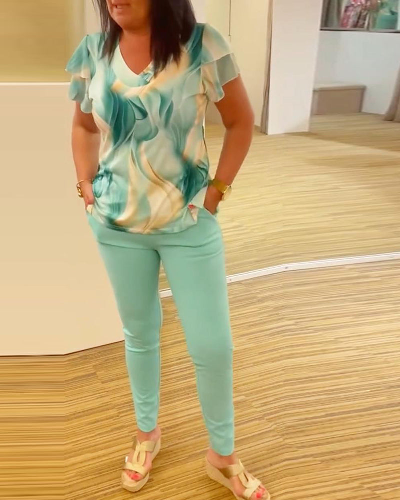 Bluse med V-hals med mønster på ermer med patchwork