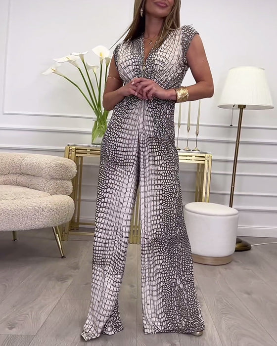 Ermeløs jumpsuit med dyp V-twist