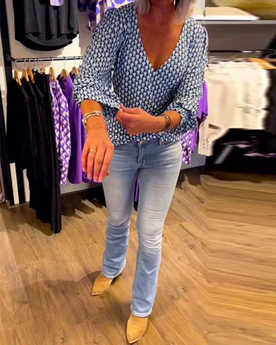 Lang ermet topp med dyp V-hals