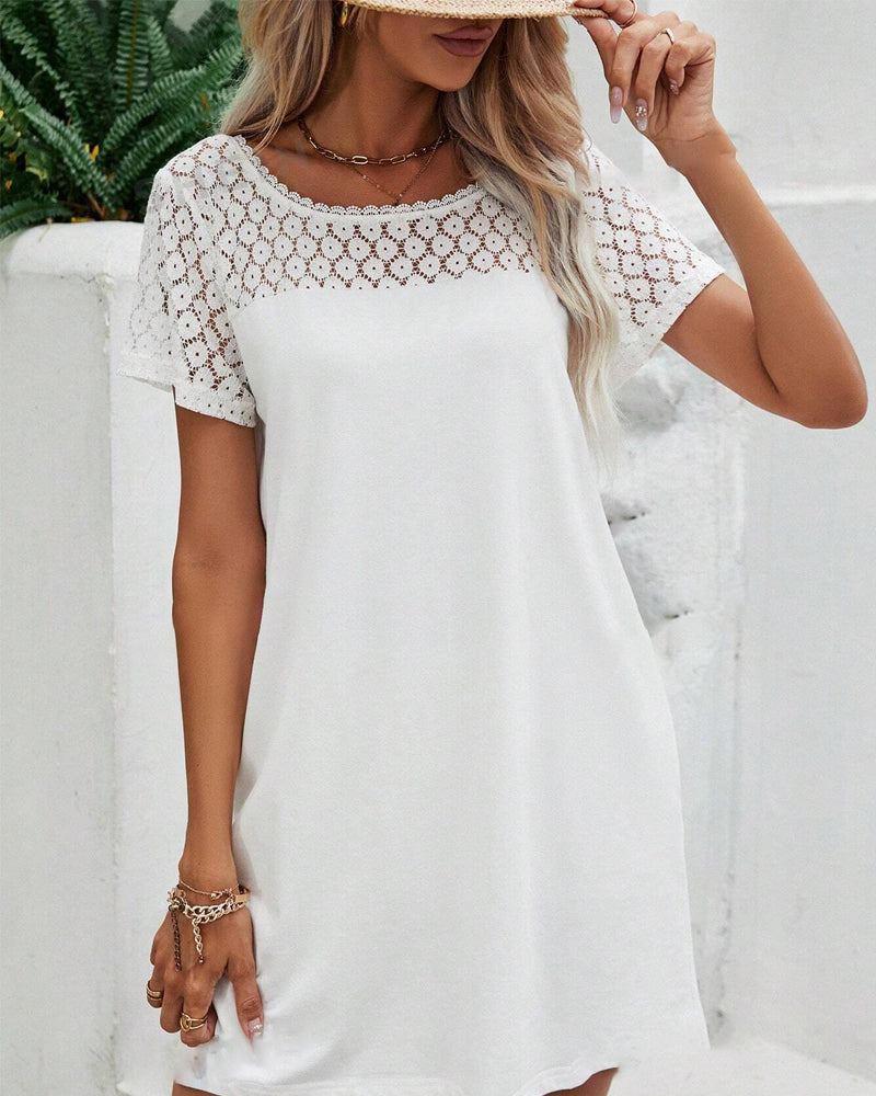 Kjole med rund hals og lappeteppe på ryggen