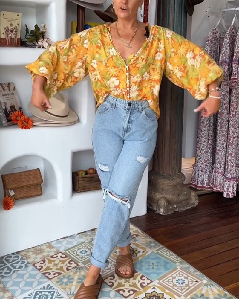 V-hals bluse med blomstertrykk