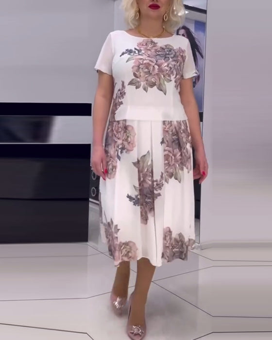 Elegant kjole med rund hals med blomstertrykk