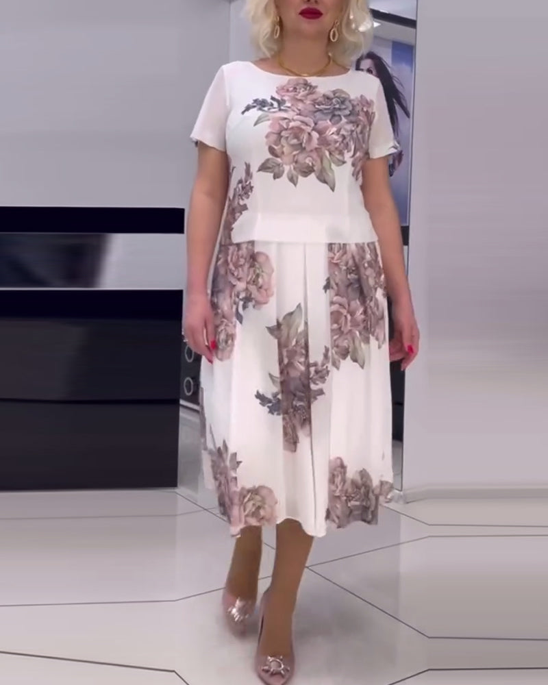 Elegant kjole med rund hals med blomstertrykk
