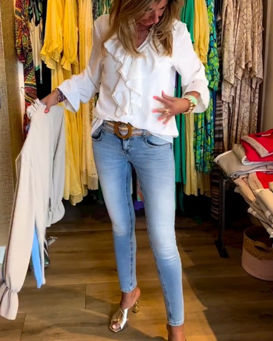 Designerbluser med volang for kvinner