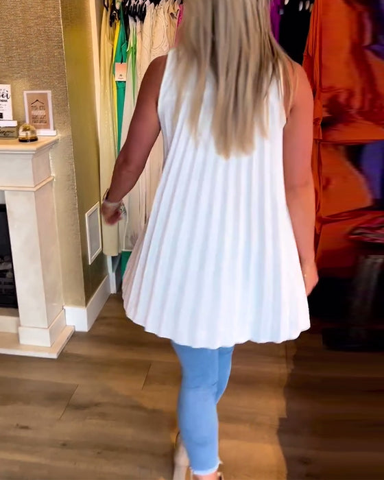 Ermeløs topp med volanger og jakkeslag