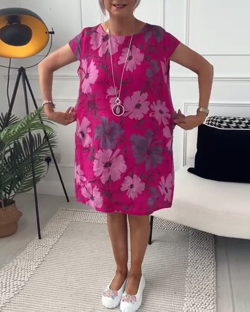 Uformell løs kjole med blomstertrykk med korte ermer og lommer