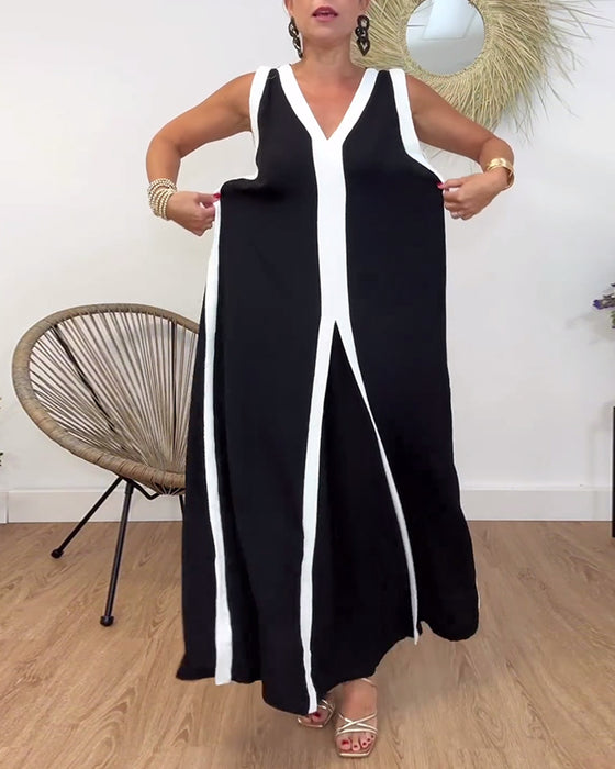 Fasjonabel ermeløs kjole med V-hals i kontrasttrykk