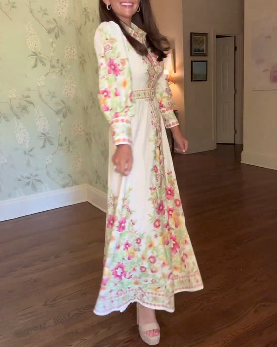 Elegant maxikjole med lange ermer i jakkeslag med blomstertrykk