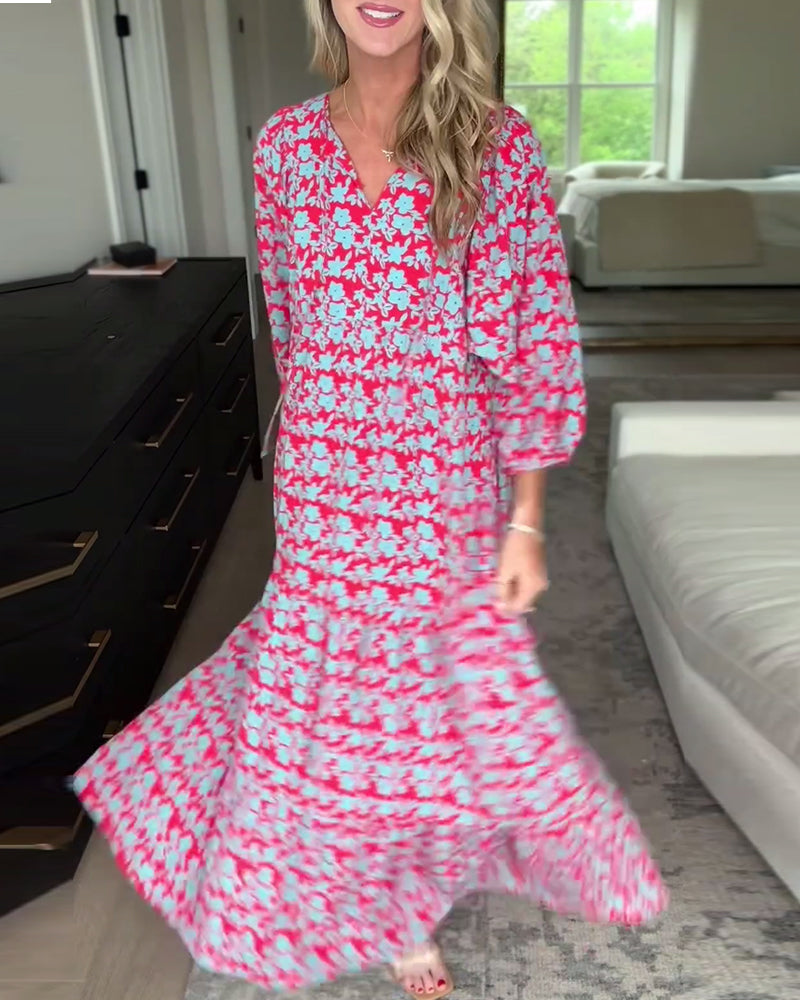 Blomstret lang kjole med V-hals med lanterneermer