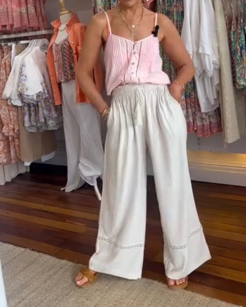 Ensfarget komfortabel bukse med brede ben med lommer