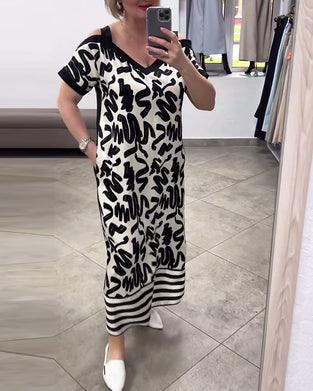 Kortermet kjole med off-the-shoulder print