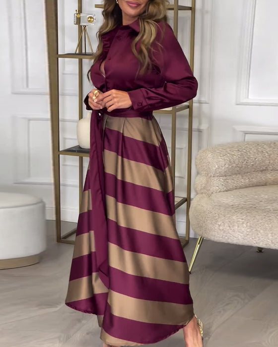 Elegant kjole med striper og jakkeslag