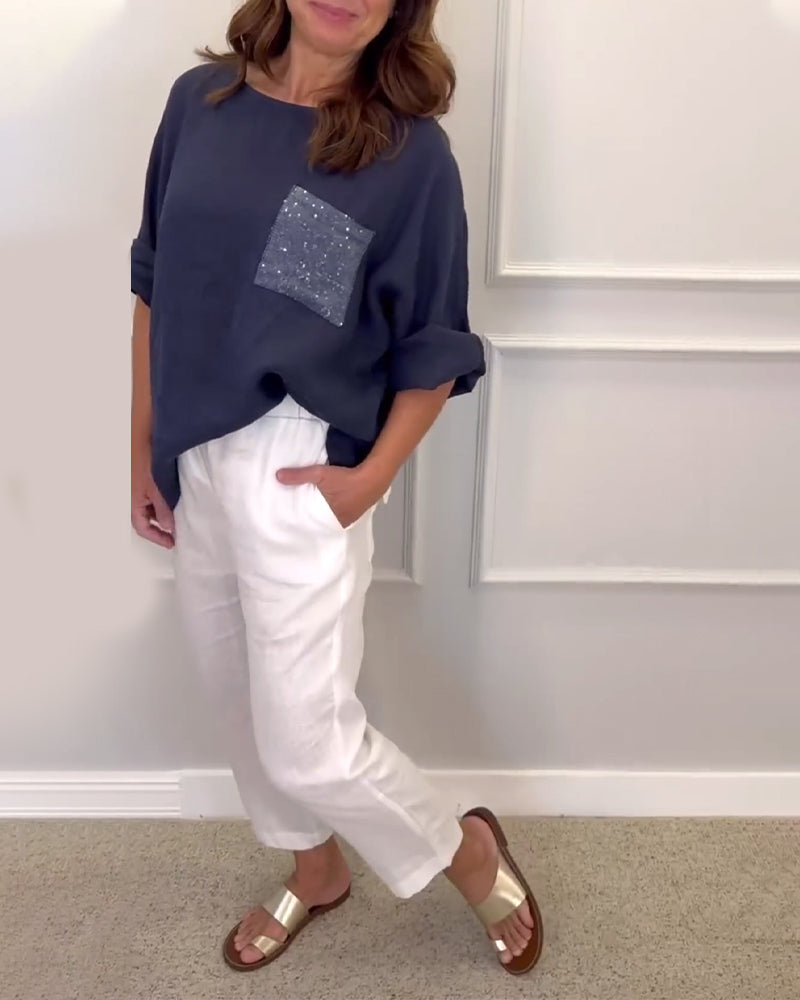 Paneldelt paljettlomme topp med rund hals