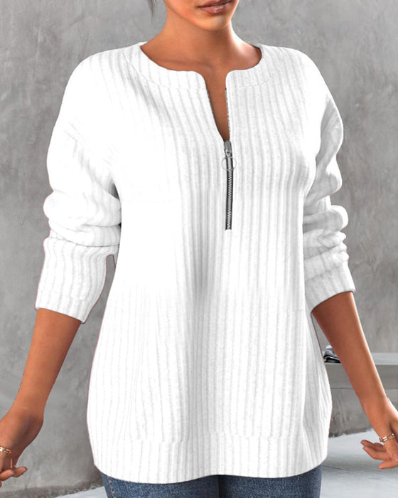 Topp med ensfarget med v-hals med glidelås