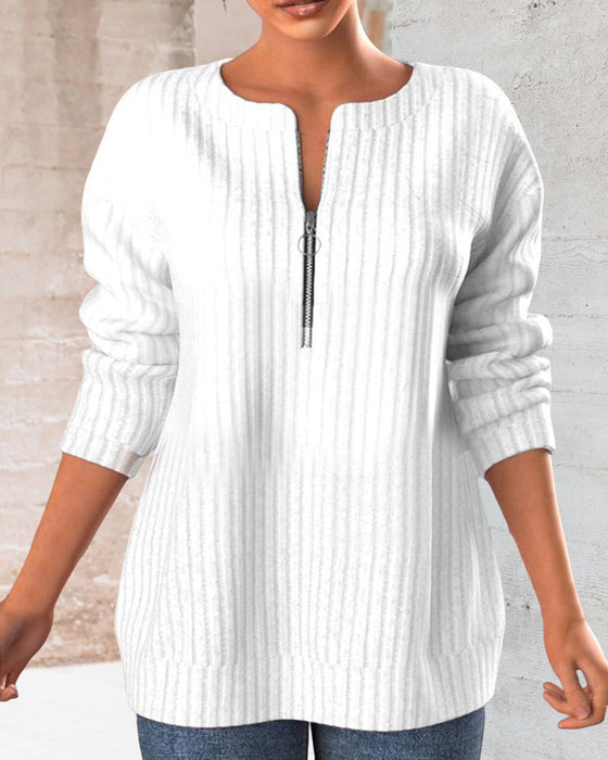 Topp med ensfarget med v-hals med glidelås