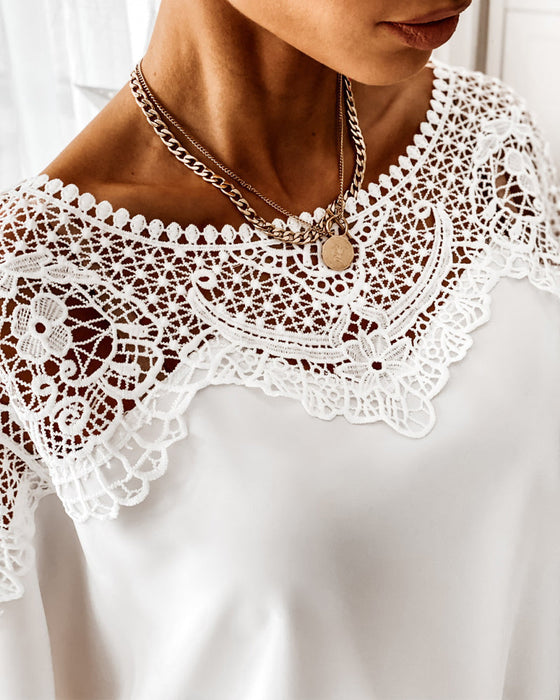 Topp med dolmanermer med blondekrage