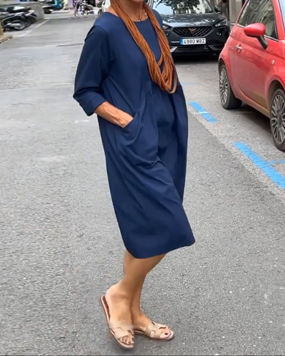 Rund halskjole med lommer