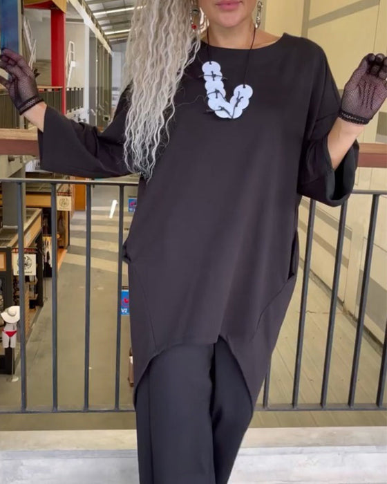 Topp med løs passform og lange ermer