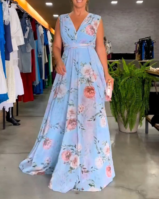 Elegant ermeløs kjole med V-hals med blomstertrykk