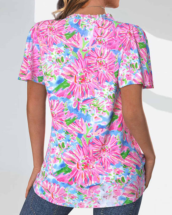 Bluse med korte ermer og blomster og knapper