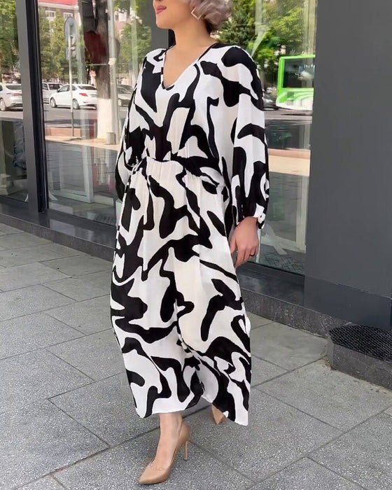 Elegant langermet kjole i motetrykk