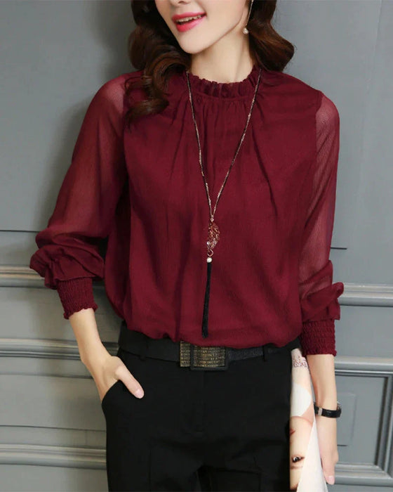 Ensfarget bluse med lanternearm