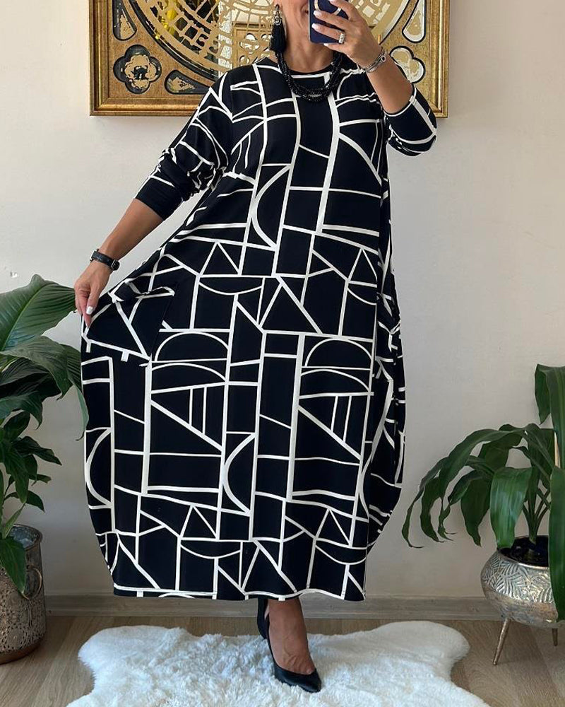 Løs shiftkjole med lomme og rund hals