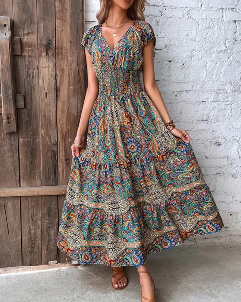 Elegant kjole med vintagetrykk