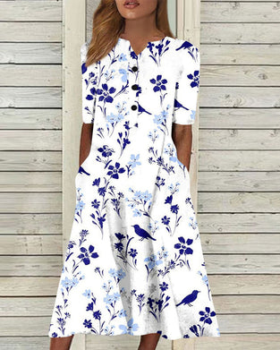 Kjole i blomsterprint med lomme