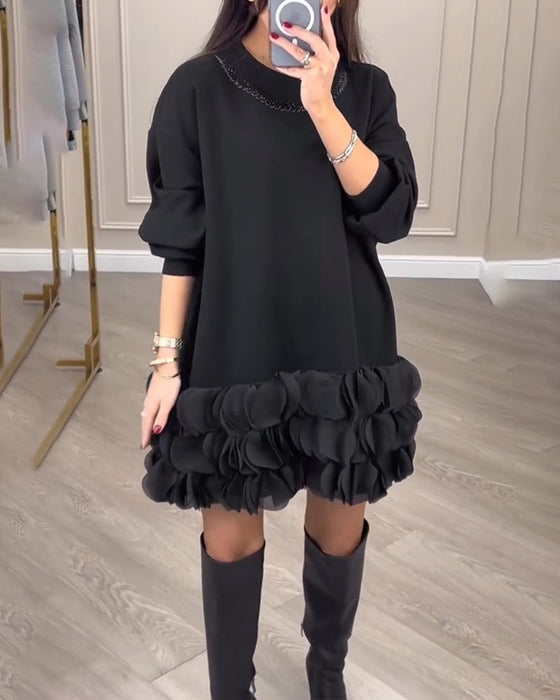 Elegant kjole med patchwork-blader