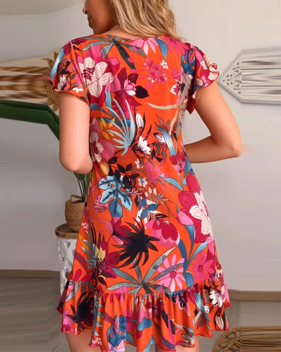 Blomsterkjole med V-hals og ruffles