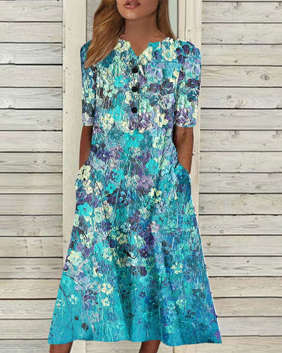 Kjole i blomsterprint med lomme
