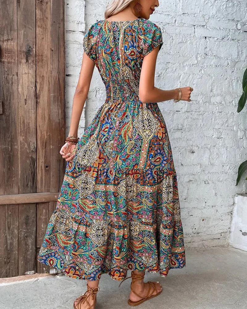 Elegant kjole med vintagetrykk