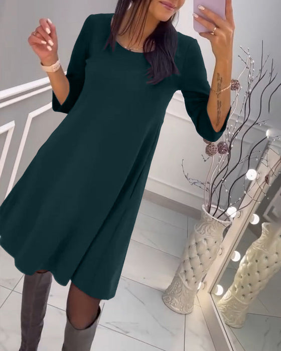 Ensfarget kjole med sløyfe bak