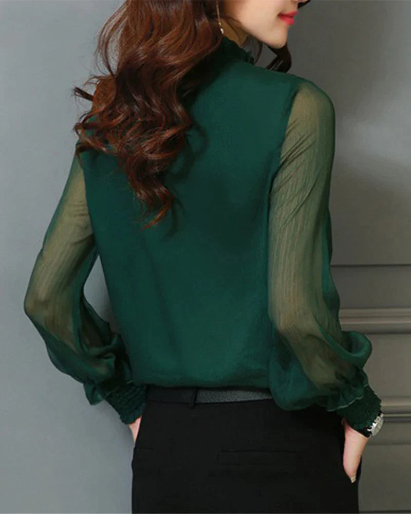 Ensfarget bluse med lanternearm