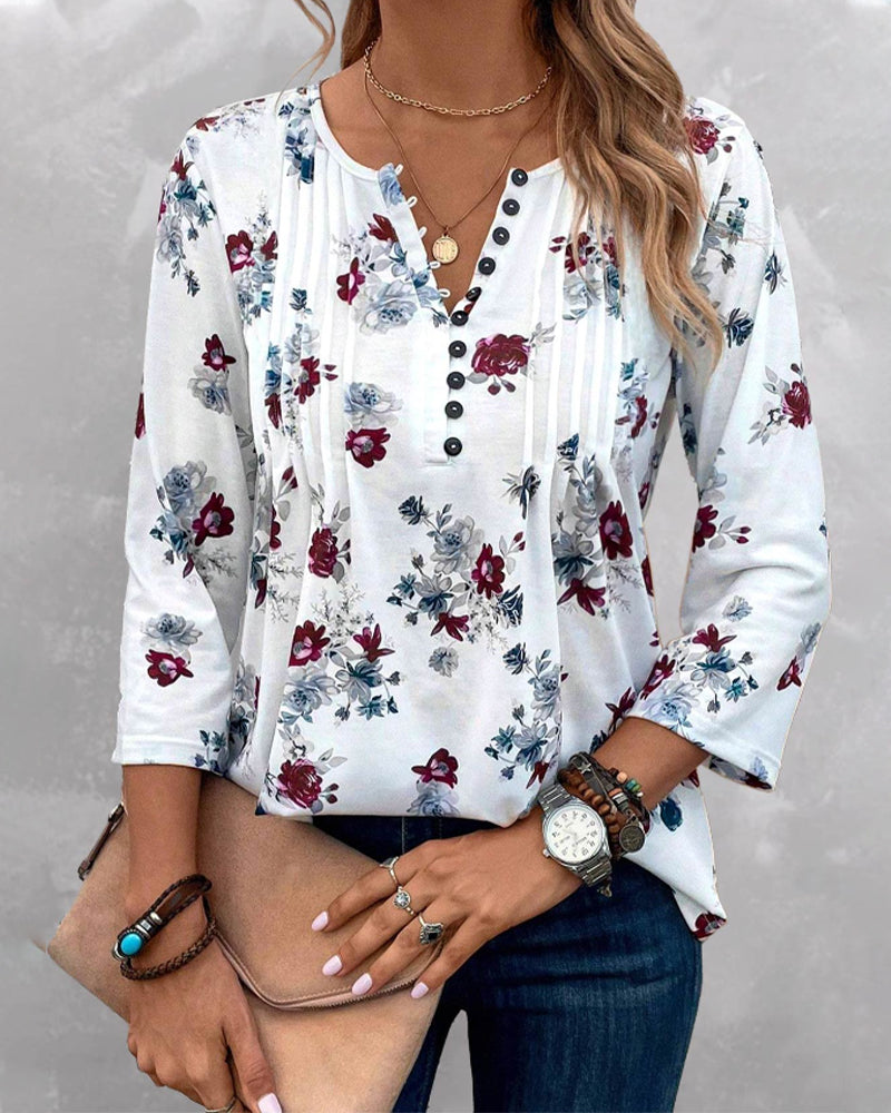 Elegant bluse med knapper med blomstertrykk