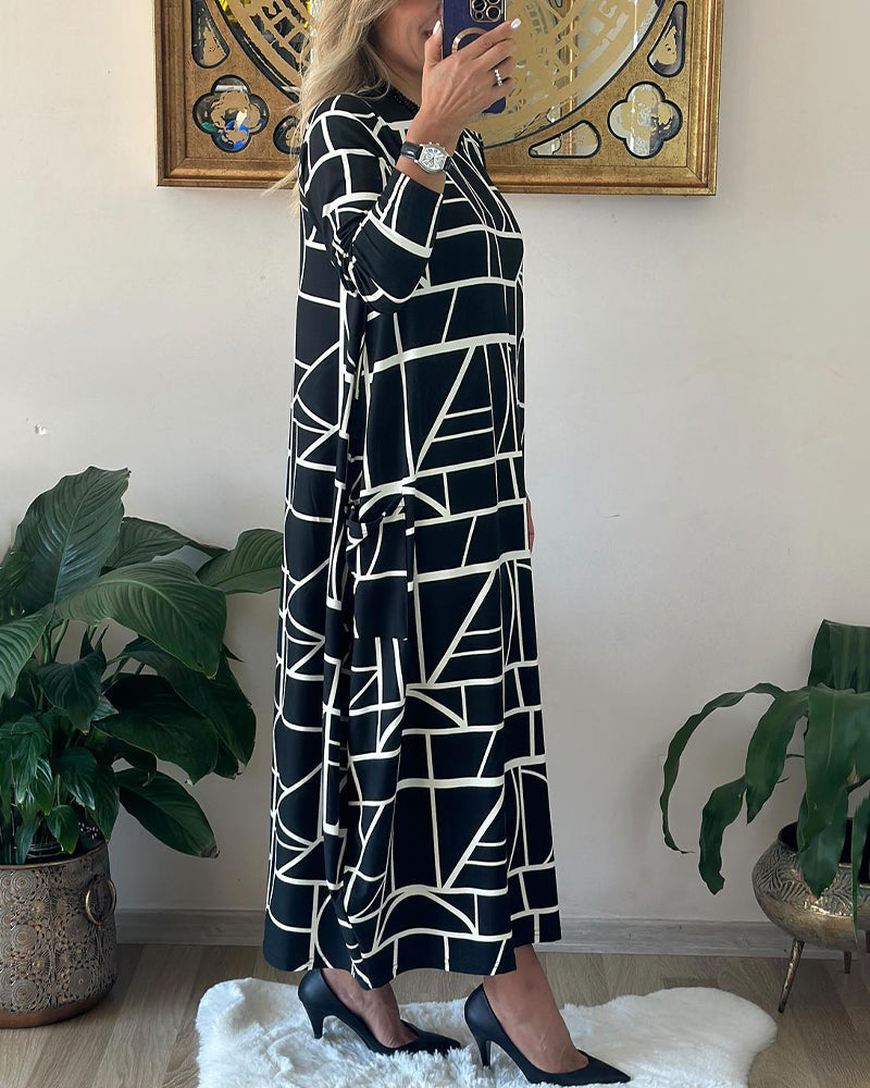 Løs shiftkjole med lomme og rund hals