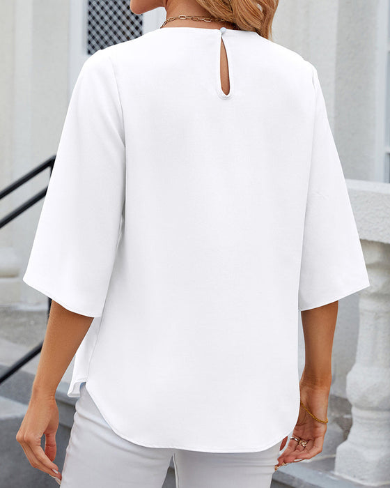 Elegant ensfarget bluse med halv erme