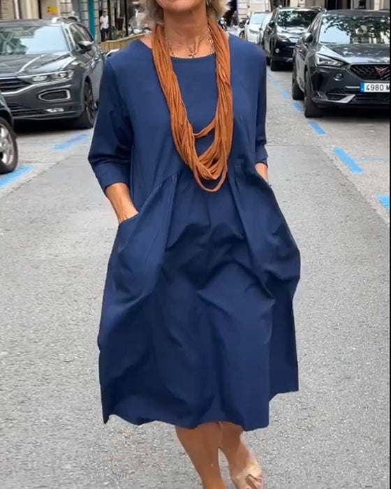 Rund halskjole med lommer