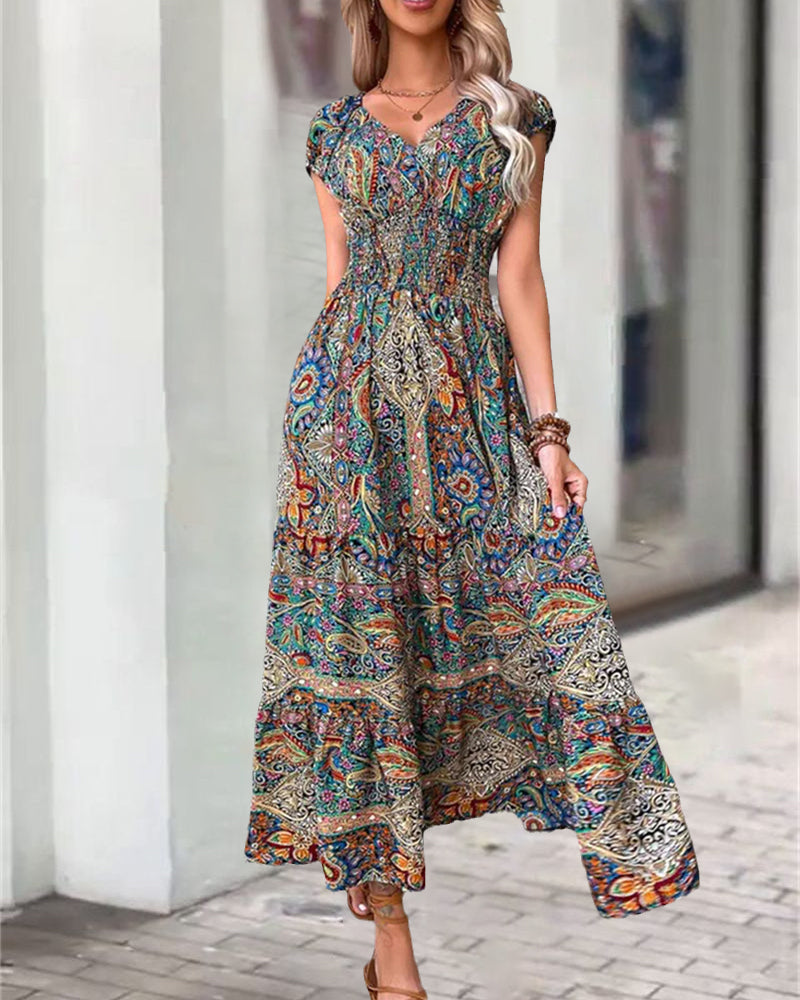 Elegant kjole med vintagetrykk