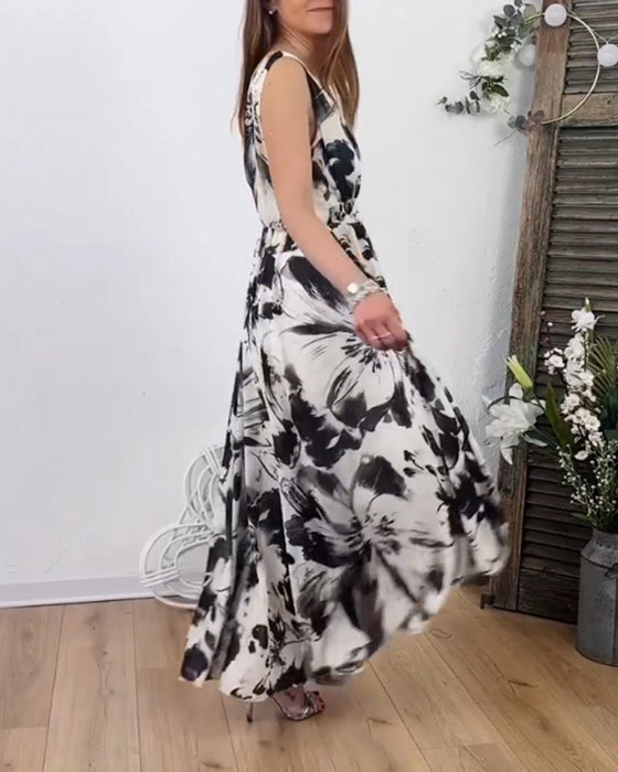 Ermeløs flytende kjole med blomstertrykk