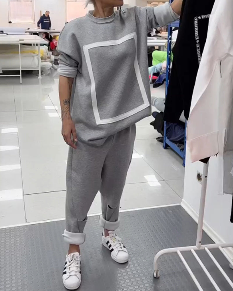 Enkel ensfarget hettegenser