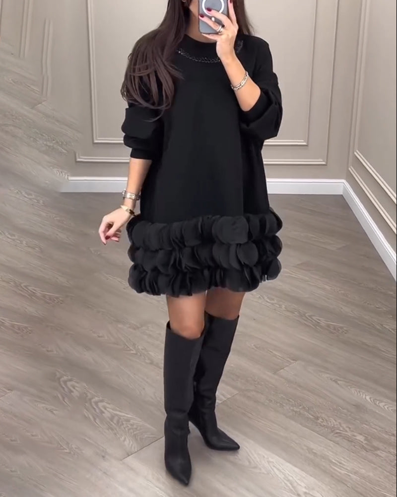 Elegant kjole med patchwork-blader