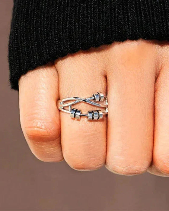 Elegant ring med angstreduserende spinnere