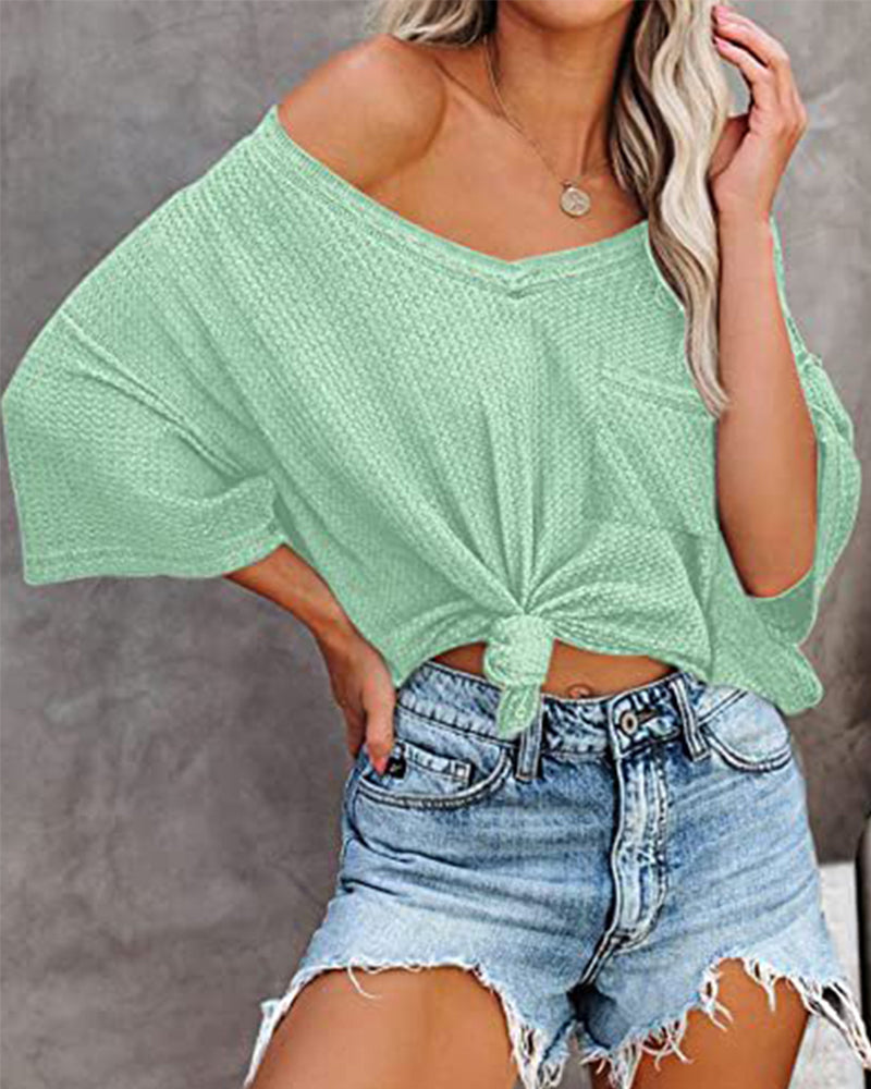 Kortermet t-skjorte med V-halslomme