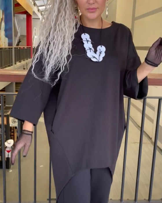 Topp med løs passform og lange ermer