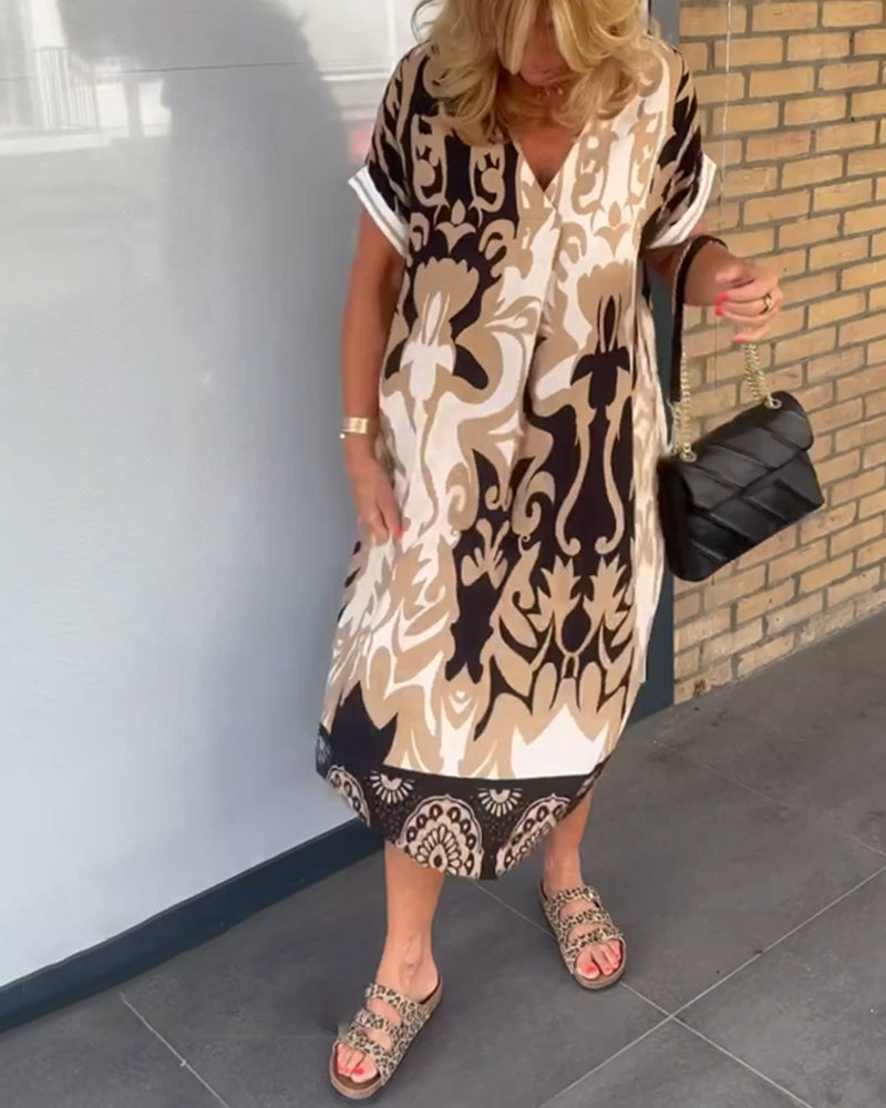 V-hals kjole med geometrisk trykk